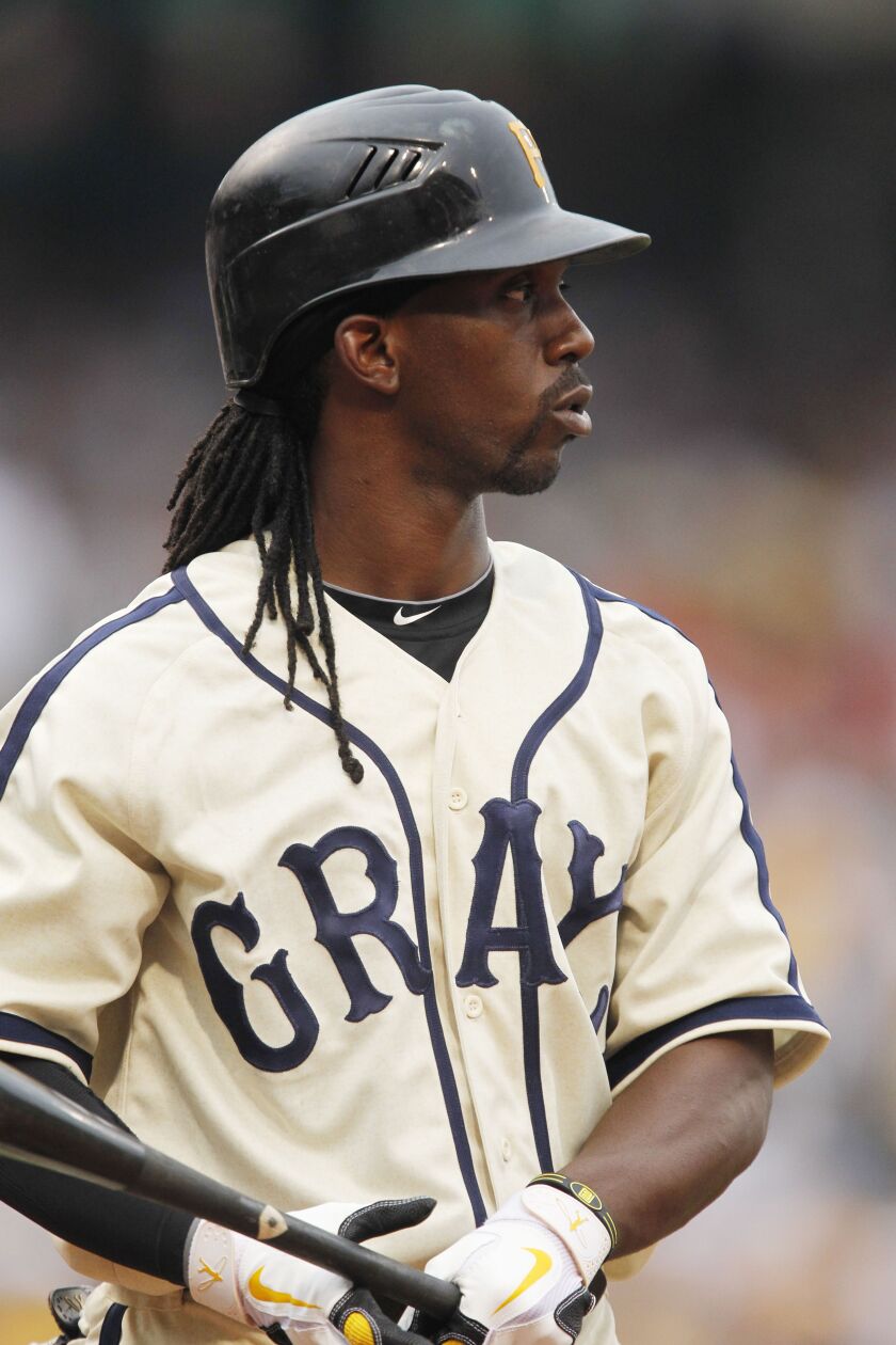 Pittsburgh Pirates’ Andrew McCutchen bats wearing the uniform of the Homestead Grays of the Negro Leagues during a baseball game against the St. Louis Cardinals in Pittsburgh Saturday, July 23, 2011. (AP Photo/Gene J. Puskar)