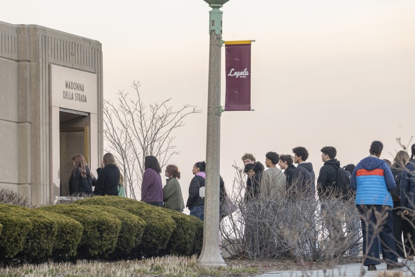Students, staff, and community members make their way into Madonna della Strada Chapel at Loyola University for a vigil for student Sheridan Gorman who was shot and killed earlier in the morning while on the pier of the Tobey Prinz Beach in the Rogers Park neighborhood, Thursday, March 19, 2026.