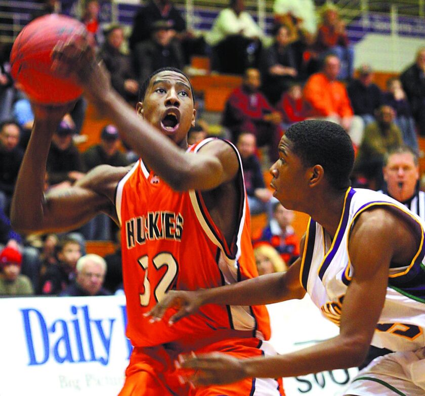 Oak Park-River Forest’s Iman Shumpert puts a move on Waukegan’s Rashaan Melvin. Sun-Times file photo.