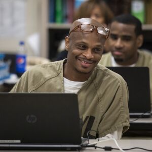 Detainee Oscar Grissett smiles after a draw during one of his games in the International Online Chess Tournament for Prisoners at Cook County Jail, Tuesday morning, Aug. 6, 2019.