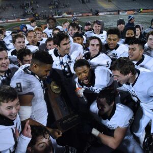 IC Catholic’s holds the Class 4A trophy. Worsom Robinson/For the Sun-Times.