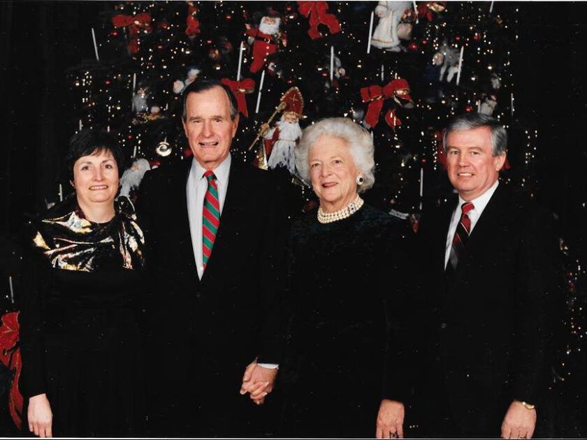 Ed Murnane, right, and his wife, Laurel, left, with President George Bush and first lady Barbara Bush in front of the White House Christmas tree. White House photo.