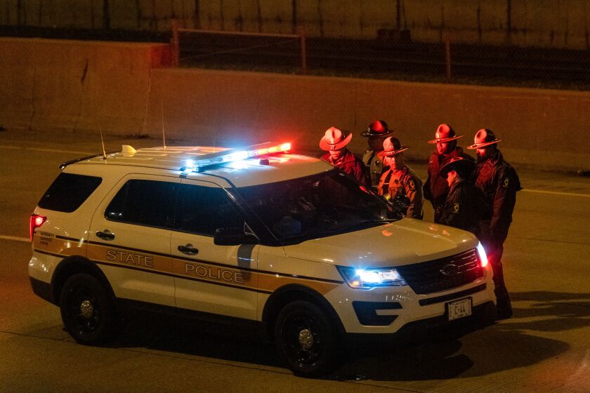 Illinois State Police officers shut down the inbound I-94 Expressway, Friday morning, looking for evidence of a shooting that happened that left a woman wounded. | Tyler LaRiviere/Sun-Times