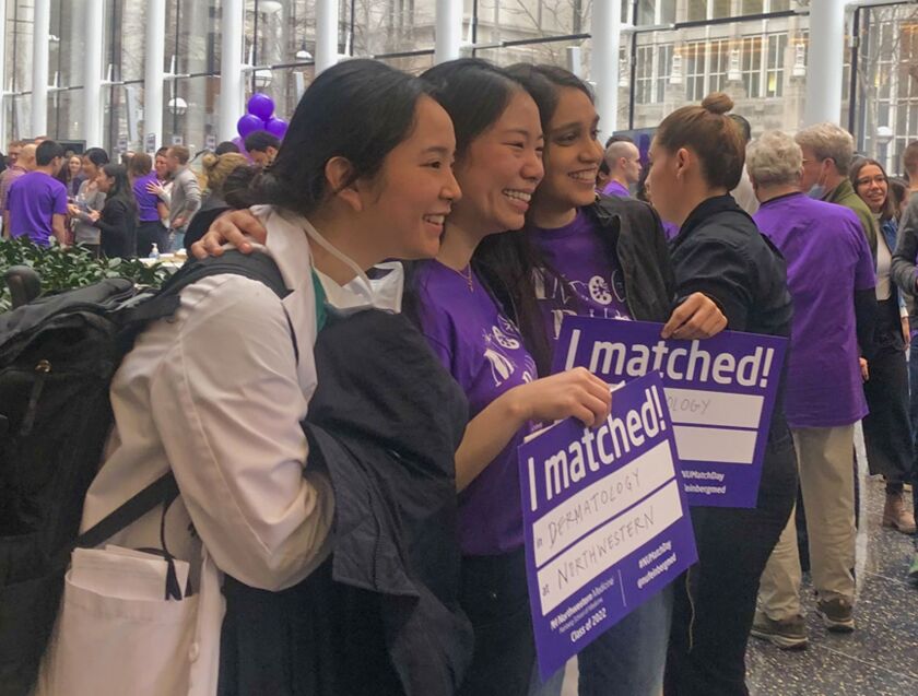 Northwestern medical student Ellen Wu stands between two classmates for a snapshot on Friday.