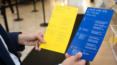 Museum of Contemporary Art Chicago’s Media Relations Director Manuel Venegas shows Spanish brochures at the Museum of Contemporary Art Chicago in Streeterville, Tuesday, Aug. 19, 2025.