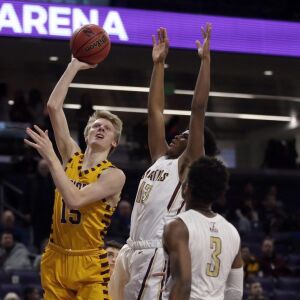 Loyola’s Bennett Kwiecinski (15) shoots over St. Ignatius’s Kolby Gilles (13) during their 56-46 win at Northwestern University in Evanston, Friday, February 8, 2019. | Kevin Tanaka/For the Sun Times