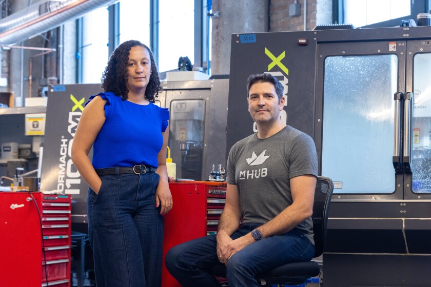 Shannon McGhee, mHUB's vice president of programs, (left) with mHUB co-founder Bill Fienup at the incubator's offices.
