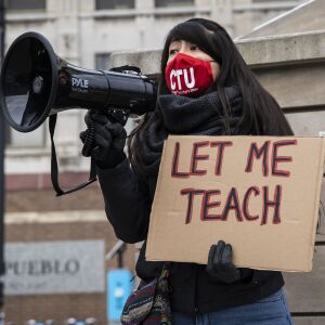 Linda Perales, a cluster teacher at Corkery Elementary School, rallies Chicago Teachers Union members and their supporters in Pilsen during a protest to call for “safety, equity and trust in any school reopening plan” on Martin Luther King Jr. Day, Monday morning, Jan. 18, 2021.