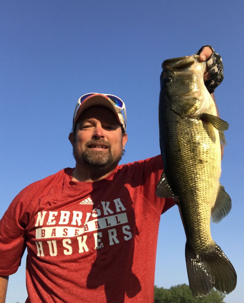 Ken “Husker” O’Malley with a local largemouth bass. Provided photo