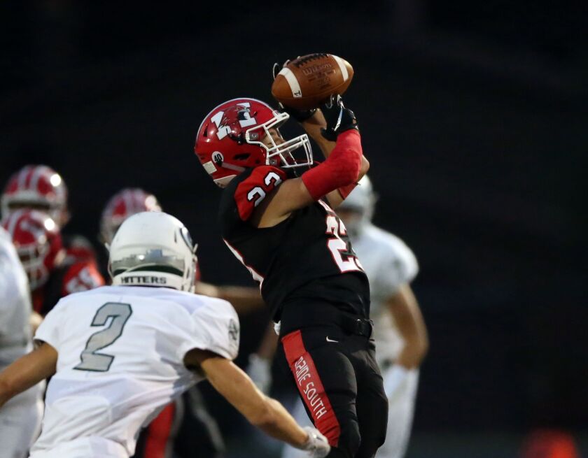 Maine South’s Dan Lazic (23) makes the catch against Glenbard West’s Sean Michel (2). Kevin Tanaka/For the Sun-Times.