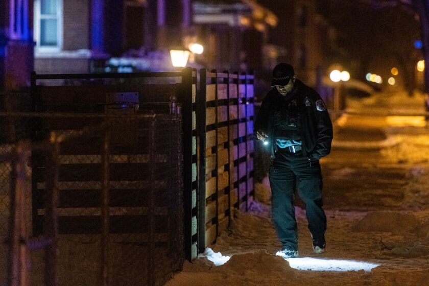 Police investigate the scene where 3 people were shot, Tuesday morning, in the 9000 block of South Bishop in the Brainerd neighborhood. | Tyler LaRiviere/Sun-Times