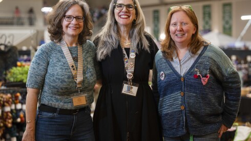 A photo of the two women who founded YarCon. From left: YarnCon founders Sara Ware, Natalia Uribe and volunteer Laura Staley at YarnCon on Saturday.