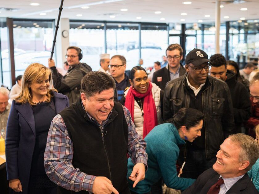 Gubernatorial candidate JB Pritzker, his running mate Juliana Stratton, attorney general candidate Kwame Raoul and others greet fellow Democrats for a lunch at Manny’s Deli on Election Day, November 6, 2018. | Max Herman/For the Sun-Times