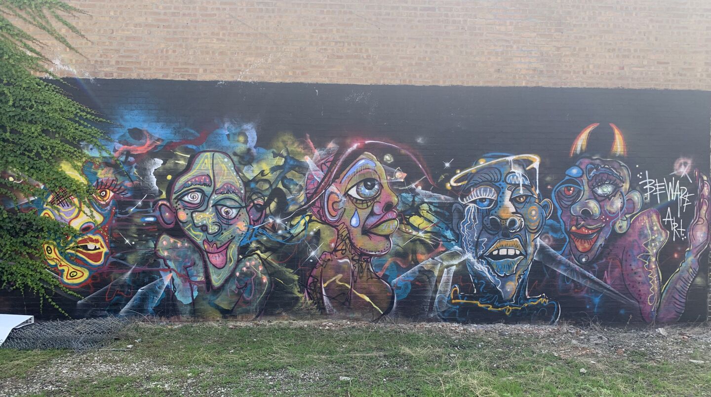 Clare Bollnow and the graffiti artist known as Joos painted this mural on Belmont Avenue just east of California Avenue in Avondale in May.