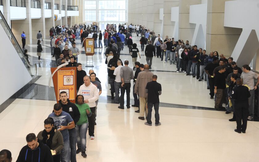 Thousands of applicants wait in long lines to take the Chicago Police Department exam at McCormick Place in December 2010.