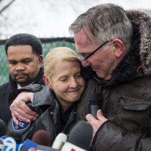 Aurora Police Chief Kristen Ziman hugs a chaplain as Mayor Richard Irvin looks on during a prayer vigil for the five people killed two days earlier in a mass shooting at the Henry Pratt Company, Sunday afternoon, Feb. 17, 2019. | Ashlee Rezin/Sun-Times