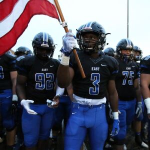Lincoln-Way East’s A.J. Henning (3) carries the flag. Allen Cunningham/For the Sun-Times.