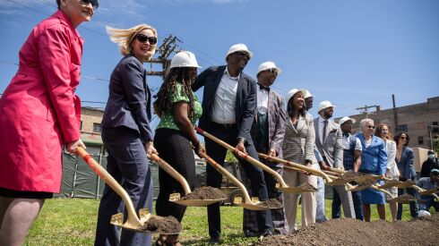 Cook County Board Commissioner Bridget Gainer, Cook County Land Bank Authority Executive Director Eleanor Gorski, Commissioner of the City of Chicago Department of Housing Marisa Novara and Cook County Board President Toni Preckwinkle and West Woodlawn Pointe developers are about to break ground during the launch of the Buy Back the Block initiative at 6314 S. Evans Ave. in the West Woodlawn neighborhood Tuesday morning.