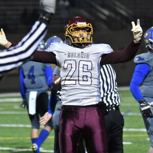 Solorio’s Eric Rodriguez (26) celebrates after falling on a fumble. Worsom Robinson/For the Sun-Times.