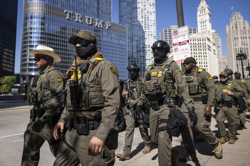Federal U.S. Customs and Border Protection agents walk along West Wacker Drive in the Loop, Sunday, Sept. 28, 2025. | Ashlee Rezin/Sun-Times