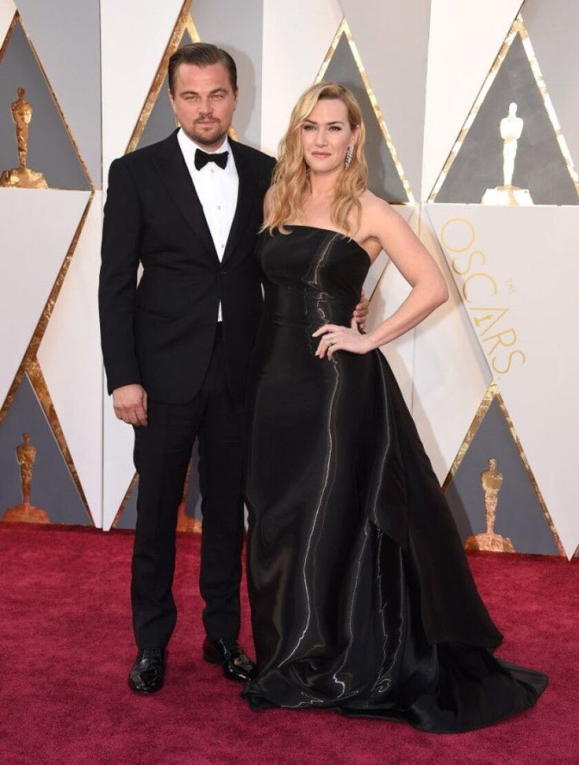 Kate Winslet, wearing a custom Ralph Lauren gown, poses with her “Titanic” co-star and Oscar nominee Leonardo Di Caprio. Di Caprio went on to win his first Academy Award, for his best actor turn in “The Revenant.” |Photo by Jordan Strauss/Invision/AP)