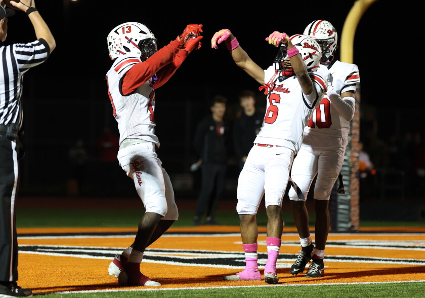 Bradley-Bourbonnais' LyZale Edmon, left, celebrates his first touchdown with Rontez Smith, right.