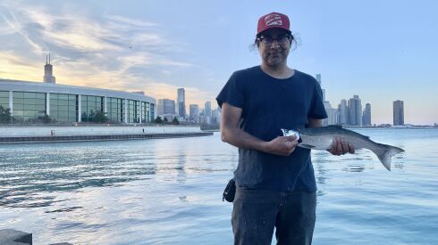Dr. Atul Mallik with a coho on the Chicago lakefront. Provided photo