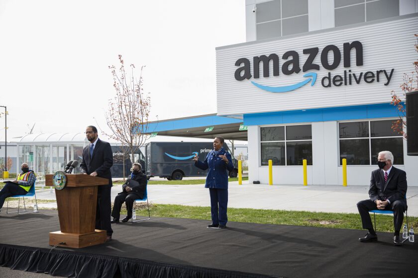 Ald. Anthony Beale (9th) speaks Wednesday about the efforts to bring Amazon to the Pullman community. Beale and Mayor Lori Lightfoot (seated, background) attended the ceremonial opening of Chicago’s first Amazon Delivery Station, 10500 S. Woodlawn Ave in Pullman.