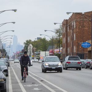 A cyclist rides down North Elston Avenue in Avondale. | Tyler LaRiviere/Sun-Times