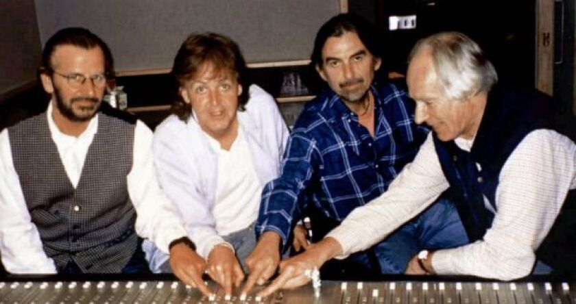 The remaining Beatles, from left: Ringo Starr, Paul McCartney, George Harrison and producer George Martin are shown in a Nov. 11, 1995, file photo during the recording of the song “Free As A Bird,” which was released 25 years after the Fab Four split. | (