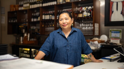 Saigon Sisters owner Mary Nguyen Aregoni stands behind the counter of her West Loop restaurant.