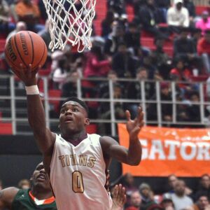 Uplift’s Markese Jacobs (0) drives to the basket against Morgan Park in the Proviso West Holiday Tournament. Worsom Robinson/ For the Sun-Times.