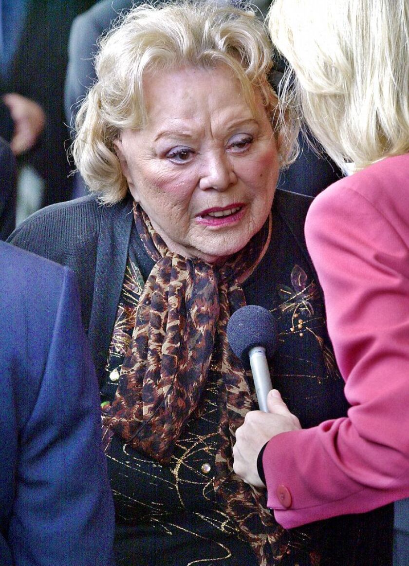 Actress, singer and comedian Rose Marie talks to reporters as she arrives for a 2002 ceremony honoring comedian Milton Berle at Hillside Memorial Park and Mortuary in Los Angeles. | Associated Press