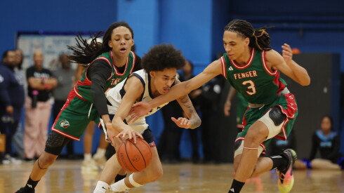 Hyde Park's Lonnie Mosley (3) battles for the ball against Fenger's Mi'cah Eddings (5, left) and Fenger's Lareese Sims (3).