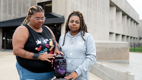 Sisters Franquella (left) and Marshawna Campbell stand with their mother’s urn outside the Cook County medical examiner’s office.