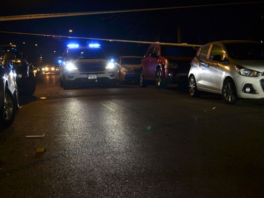 Chicago police investigate the scene where a person was shot Saturday night in the 4700 block of West Gladys, in the West Garfield Park neighborhood. | Justin Jackson/ Sun-Times