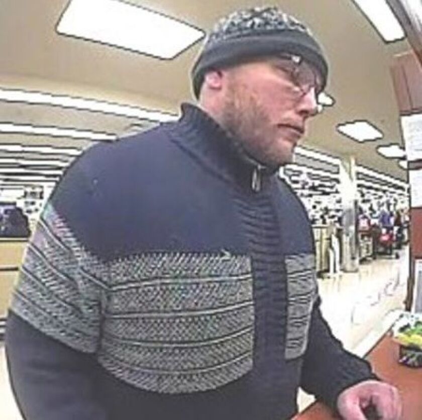 Surveillance photo of the suspect who robbed a TCF Bank branch March 30 in Lake View. | FBI