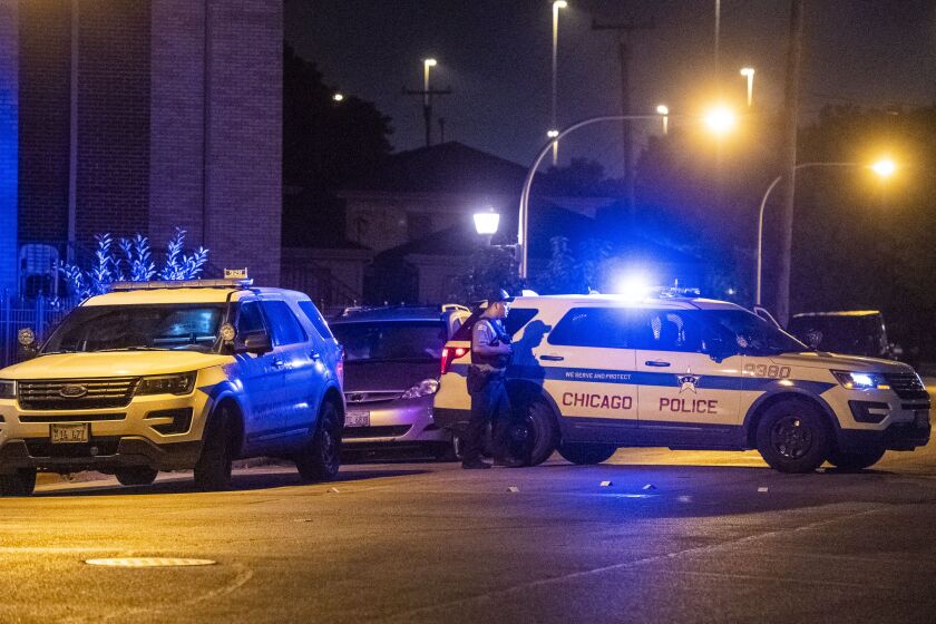 Chicago police investigate a scene with shell casings in the 3200 block of South Hamilton, this appears to be related to a shooting that happened in the 3500 block of South Hoyne a few blocks away. | Tyler LaRiviere/Sun-Times