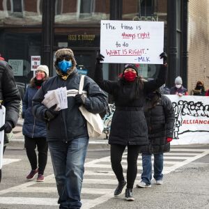 Chicago Teachers Union members and their supporters march and protest in Pilsen after a press conference outside Joseph Jungman Elementary School to call for “safety, equity and trust in any school reopening plan” on Martin Luther King Jr. Day, Monday morning, Jan. 18, 2021.