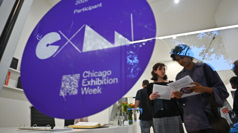 Visitors view materials and guides during Chicago Exhibition Week.