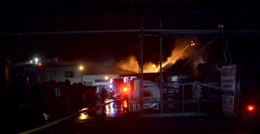 Firefighters were battling a massive recycling plant fire early Thursday in the 1200 block of Rand Road. Fire Chief Alan Wax of the Des Plaines Fire Department said crews expect to be on scene for hours. | Justin Jackson/ Sun-Times