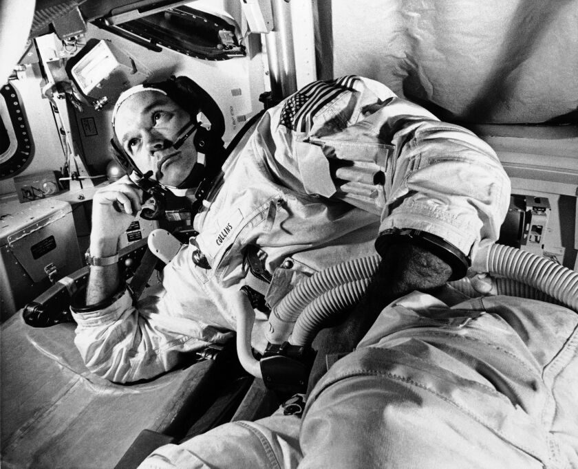 In this June 19, 1969 file photo, Apollo 11 command module pilot astronaut Michael Collins takes a break during training for the moon mission, in Cape Kennedy, Fla. Collins, who piloted the ship from which Neil Armstrong and Buzz Aldrin left to make their historic first steps on the moon in 1969, died Wednesday, April 28, 2021, of cancer, his family said. He was 90.