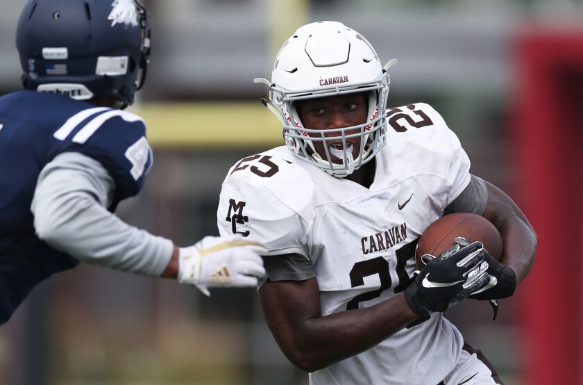 Mount Carmel’s Kyle Davis (25) runs the ball. Allen Cunningham/For the Sun-Times.