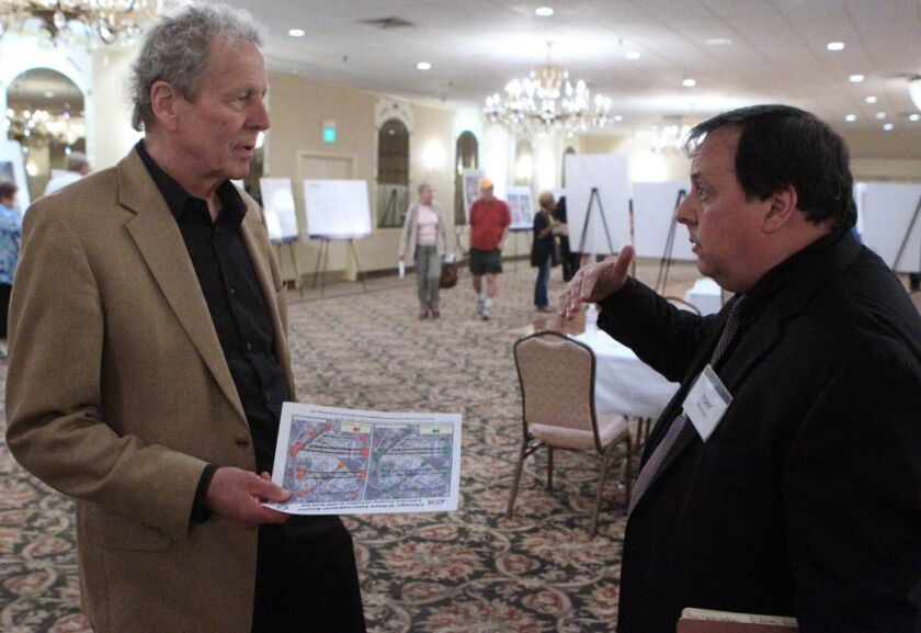 John Van Winkle, of Chicago, asks FAA spokesman Tony Molinaro how he can find his property on the maps. | Kevin Tanaka/For Sun-Times Media