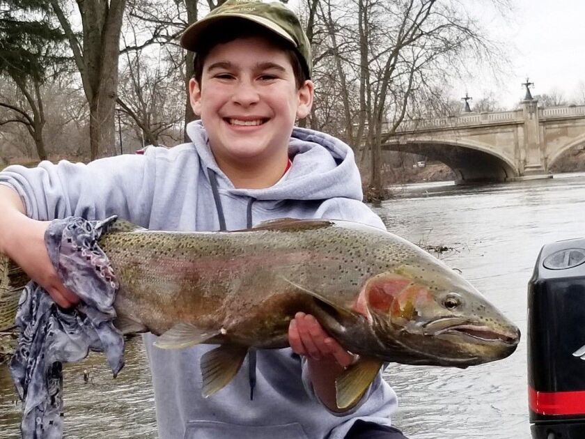 Ryan Lipsett with his first steelhead, a buck caught on the St. Joseph River. Provided photo