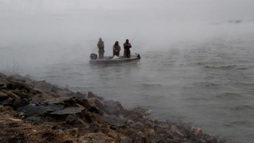 Opening day on Tuesday at Braidwood Lake had a lot of scenes like this with fishermen popping in and out.<br>Credit: Dale Bowman