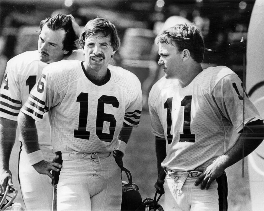 Bear kickers Vince Abbott (left), Bob Thomas (center) and Steve Clark await their next kicks during a practice at the Bears summer training camp in 1984