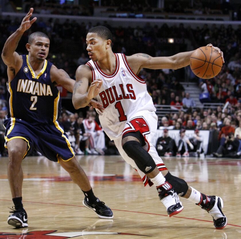 Derrick Rose drives on Indiana Pacers guard Earl Watson during the second half of their game on Dec. 29, 2009. Rose led all scorers with 23 points in the Bulls’ 104-95 win. | Charles Rex Arbogast/Associated Press