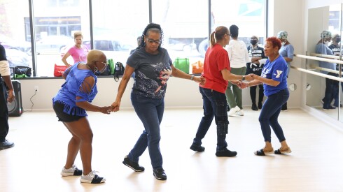 Members of the 2 Sisters Line Dance & Steppin during a workshop at the opening of the Sankofa Village Wellness Center on Thursday.