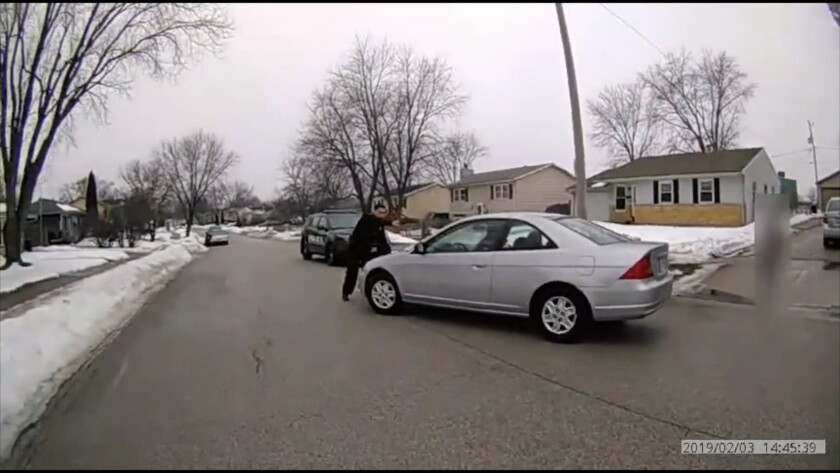 Still from a body camera video showing a Waukegan police officer fatally shooting a man who drove a car at him on Feb. 3, 2019, in the 3500 block of Windhaven Drive in Waukegan.